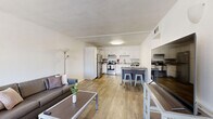 Located at 1725 N Park Ave in Tucson, AZ, this 2-bedroom, 2-bathroom unit offers a functional and well-designed single-floor layout. Wood-style flooring runs throughout, creating a cohesive and clean aesthetic across all rooms.

The combined kitchen and living area forms the heart of the unit. The kitchen is outfitted with stainless steel appliances — including an electric range, dishwasher, and refrigerator — complemented by white cabinetry and granite-style countertops. A dining area adjacent to the kitchen provides space for casual meals. The living room is bright and open, with a large window that brings in natural light and a sliding closet for added storage.

The primary bedroom is a comfortable size, featuring a large arched window, a mirrored sliding closet, and direct access to one of the two bathrooms. The second bedroom is efficiently laid out with wood-style flooring, a ceiling vent, and its own hallway access to the second bathroom. Both bathrooms are clean and functional, each featuring a granite-topped vanity with white cabinetry. One bathroom includes a full walk-in shower stall, while the other is accessible from the hallway. A connecting hallway ties the bedrooms and bathrooms together for a practical flow throughout the unit.