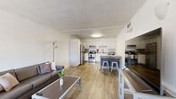 Located at 1725 N Park Ave in Tucson, AZ, this 2-bedroom, 2-bathroom unit offers a functional and well-designed single-floor layout. Wood-style flooring runs throughout, creating a cohesive and clean aesthetic across all rooms.

The combined kitchen and living area forms the heart of the unit. The kitchen is outfitted with stainless steel appliances — including an electric range, dishwasher, and refrigerator — complemented by white cabinetry and granite-style countertops. A dining area adjacent to the kitchen provides space for casual meals. The living room is bright and open, with a large window that brings in natural light and a sliding closet for added storage.

The primary bedroom is a comfortable size, featuring a large arched window, a mirrored sliding closet, and direct access to one of the two bathrooms. The second bedroom is efficiently laid out with wood-style flooring, a ceiling vent, and its own hallway access to the second bathroom. Both bathrooms are clean and functional, each featuring a granite-topped vanity with white cabinetry. One bathroom includes a full walk-in shower stall, while the other is accessible from the hallway. A connecting hallway ties the bedrooms and bathrooms together for a practical flow throughout the unit.