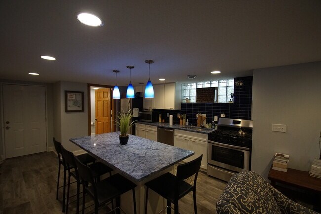 Basement unit from bedroom door towards kitchen/bath - 3552 Irving Ave S