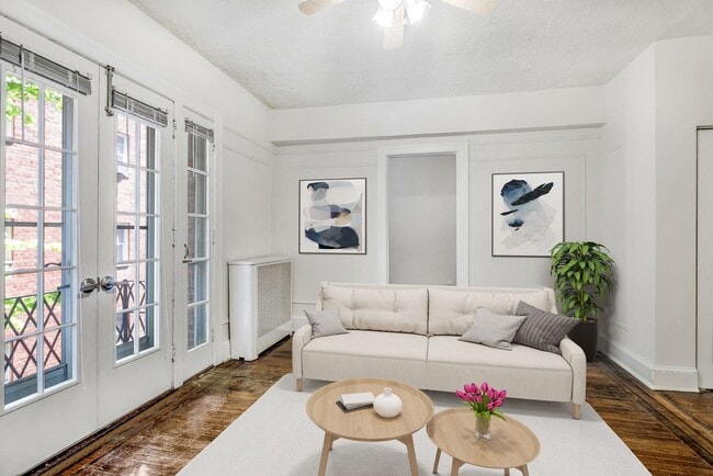One-bedroom apartment living area (virtually staged) - Highview and Castle Manor
