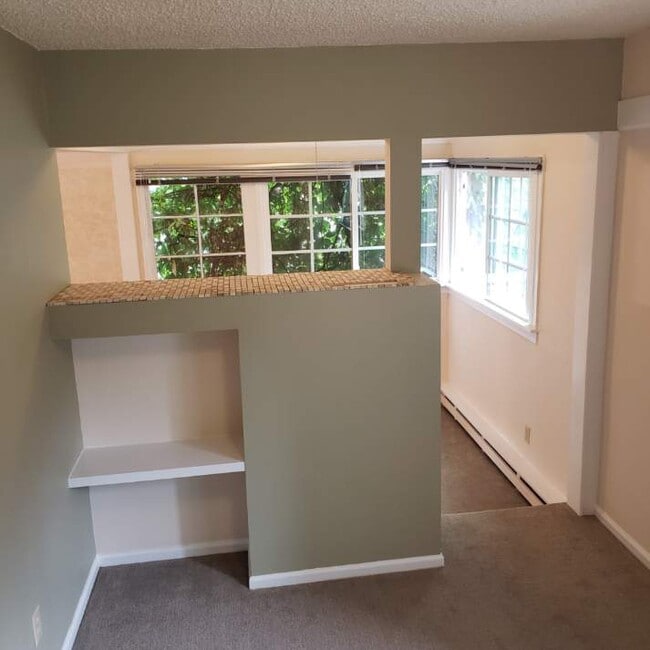 bedroom with built-ins and tile top between livingroom - 502 Canon Ave