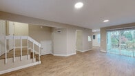 Located at 7311 Black Bay Ct in Indianapolis, Indiana, this two-story home offers three bedrooms, three full bathrooms, and a practical, well-organized layout spread evenly across two floors. The main level features a living room and dining room area, with light wood-look luxury vinyl flooring extending throughout. The kitchen is equipped with warm-toned wood cabinetry, a marble-style tile backsplash, light stone countertops, stainless steel appliances including a refrigerator and dishwasher, and a double sink — creating a functional and attractive cooking space. A pantry and laundry area add to the home's convenience on this floor. Upstairs, the three bedrooms are finished with plush carpet and neutral walls. The primary bedroom includes its own closet and direct access to a private bathroom featuring a vanity with a brushed nickel faucet and a glass-enclosed shower. Additional bedrooms offer natural light through large windows with views of the surrounding neighborhood. The two remaining bathrooms include a tub/shower combo with brushed nickel fixtures. Multiple closets are distributed throughout both floors, ensuring ample storage. Carpeted staircases connect the levels, and the home's consistent neutral color palette and clean finishes create a cohesive, move-in-ready feel throughout.