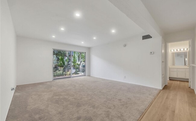 Replaced the carpet with wood vinyl floor - 5460 White Oak Ave