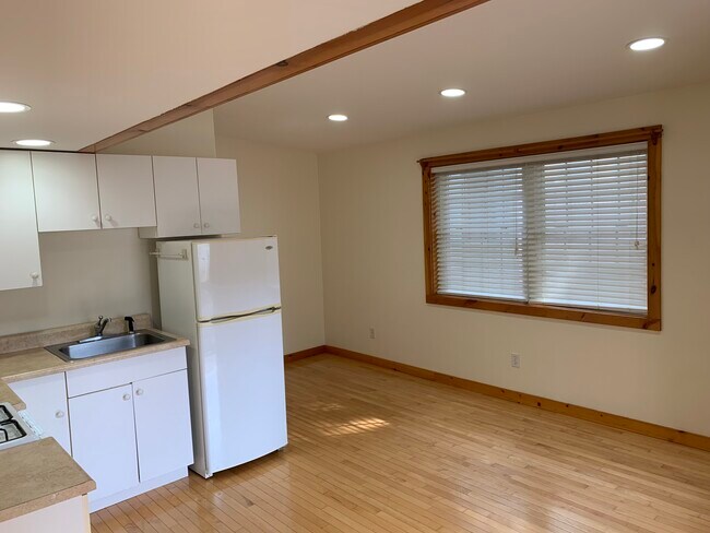 Looking from bedroom doorway into open-concept kitchen/living room area - 37 Court St
