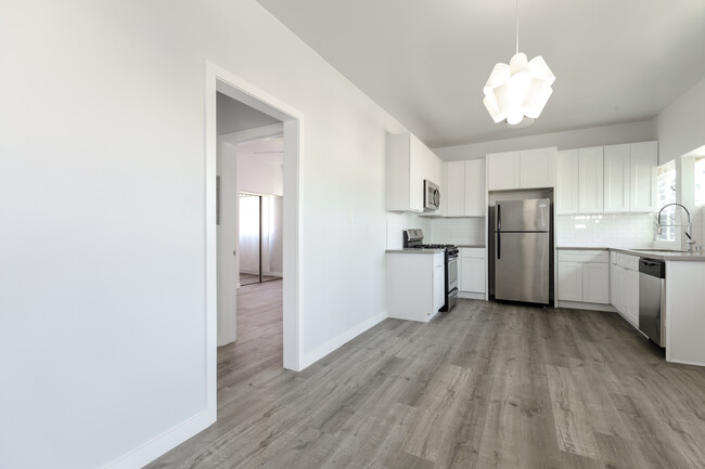 Spacious modern Kitchen with stainless-steel appliances, large open dining area and living room area - 4808 August St
