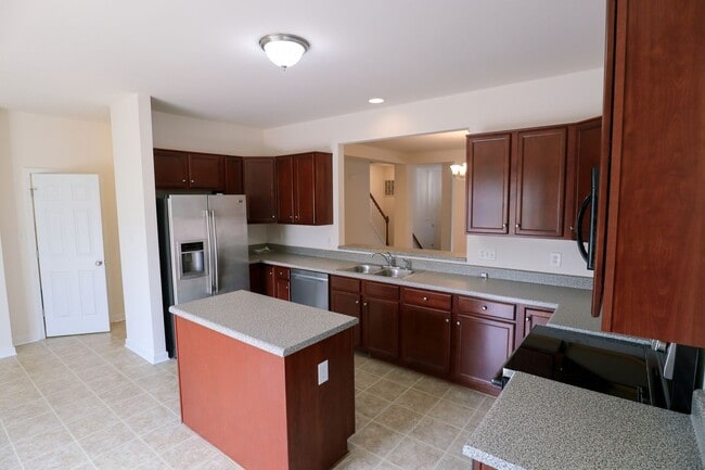 Building Photo - Spacious 4BR Home with Garage Steps from C...