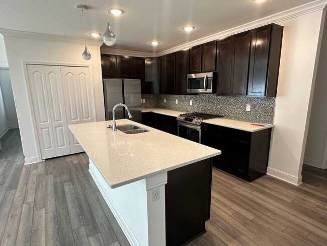 Building Photo - Nearly New 3 Bedroom Smart Home with Lawn Care Included!