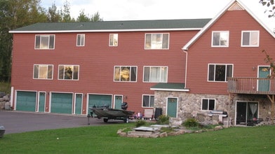 Garages for units 1,2 & 3  & front entry to unit #4 - 5185 Samuelson Rd