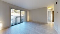 Located at 1659 Monroe Dr NE in Atlanta's vibrant 30324 corridor, this 2-bedroom, 1-bathroom residence offers a thoughtfully designed single-floor layout with a clean, modern aesthetic throughout. Light wood-style tile flooring flows seamlessly across all living areas, creating a cohesive and bright atmosphere.

The open living room is a standout feature, bathed in natural light through large sliding glass doors that lead to a private balcony with outdoor views. The adjacent kitchen is well-equipped with white shaker-style cabinetry, granite countertops, a classic subway tile backsplash, and a full suite of stainless steel appliances including a range, microwave, dishwasher, and refrigerator. A convenient pass-through connects the kitchen to the dining and living areas.

Both bedrooms are comfortably sized, each featuring ceiling fans, generous natural light from large windows, and dark double-door closets that provide ample storage. The primary bedroom includes a double closet and peaceful outdoor views through a wide window.

The bathroom is finished in a contemporary style with large-format tile flooring, a floating vanity with undermount sink, and a tub-shower combo with glass sliding doors. Additional spaces include a laundry area, utility room, hallway, and four closets throughout, rounding out the functional floor plan.