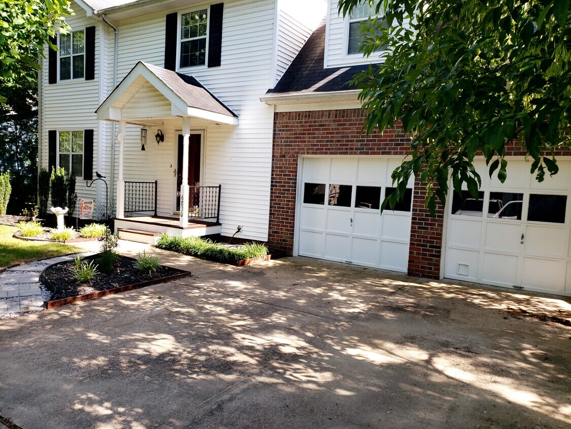 Front of house with 2 car garage - 6830 Benwood Dr