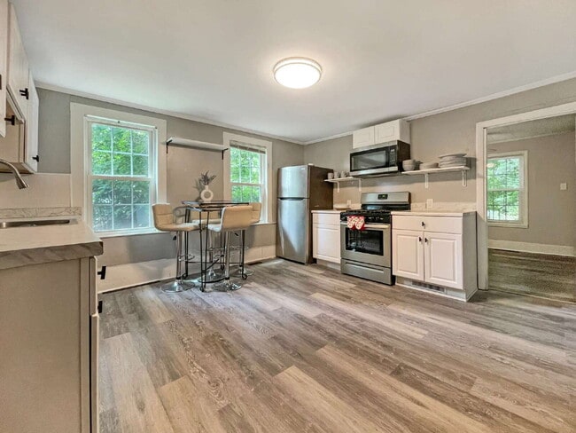 Building Photo - Seeking a roommate for a 2 bdr, 2 bath lower level condo with a porch and private yard, 1.5 miles...