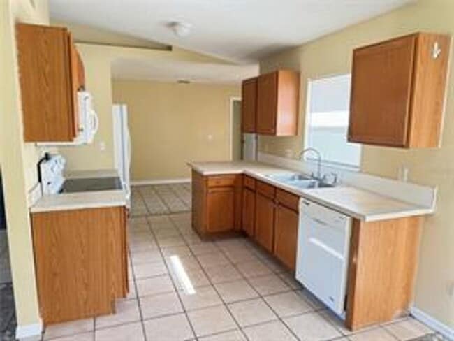 Building Photo - Charming 3-bed, 2-bath POOL home with 2-car garage. Features ceramic tile flooring, updated kitch...