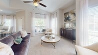 Located at 2323 Long Reach Dr in Sugar Land, TX, this thoughtfully designed one-bedroom, one-bathroom residence offers a refined living experience across a single, well-organized floor. The open-concept kitchen and living area serves as the heart of the home, where the kitchen features crisp white shaker cabinetry, quartz countertops, stainless steel appliances, pendant lighting, and rich wood-look flooring that anchors the space with warmth. The living room transitions seamlessly from the kitchen, showcasing vaulted ceilings, a ceiling fan, plush carpet, and large arched windows that invite abundant natural light and views of lush greenery outside. The spacious bedroom continues the airy feel with vaulted ceilings, a ceiling fan, soft carpet, a generously sized arched window, and a built-in shelving nook that adds both character and functionality. The bathroom is elegantly appointed with large-format marble-look tile flooring, a white vanity with ample cabinet storage, and a tub-shower combination with matching marble-look surround. A connecting hallway ties the layout together efficiently. Throughout the residence, neutral tones, quality finishes, and carefully considered design details create a cohesive, sophisticated ambiance.