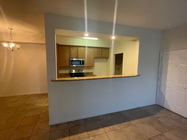 Building Photo - Beautiful Condominium in Gated Community i...