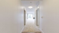 This 1140 square foot apartment in Marina Del Rey offers a harmonious blend of comfort and contemporary design. The single-story layout encompasses three bedrooms, including a primary bedroom of 160 square feet, and three full bathrooms. The heart of the home is an open-concept kitchen and living area, showcasing modern aesthetics with warm wood cabinetry, stainless steel appliances, and a sleek subway tile backsplash. The living room is enhanced by a fireplace with a wooden mantel and sliding glass doors leading to a balcony, providing a seamless indoor-outdoor living experience. Large windows throughout allow abundant natural light and glimpses of palm trees, creating a bright and airy ambiance. Plush carpeting in the bedrooms and living areas offers comfort underfoot, while the kitchen and bathrooms feature durable tile flooring. The apartment boasts ample storage with multiple closets, including a well-organized walk-in closet with adjustable shelving and hanging rods. Bathrooms are appointed with granite countertops and modern fixtures. This residence combines functionality with style, perfect for those seeking a contemporary living space in a desirable Marina Del Rey location.
