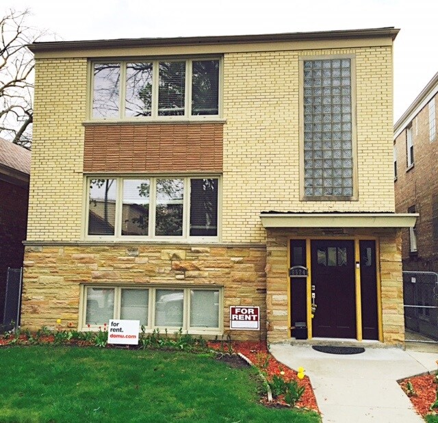Solid yellow brick building - 6524 N Rockwell St