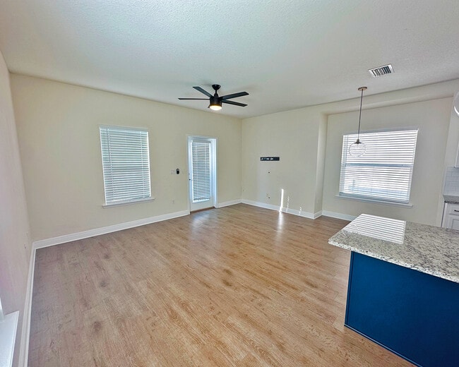 Bright living room featuring tall ceilings, modern finishes, and an open l - 1736 W Walnut St