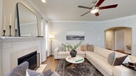 Located in Frisco, TX, this well-appointed 2-bedroom, 2-bathroom single-story home offers a thoughtfully designed layout with stylish finishes throughout. The inviting living room serves as the heart of the home, showcasing rich hardwood flooring, crown molding, a classic white fireplace, and a ceiling fan with light fixture. Multiple windows allow natural light to fill the space, creating a warm and welcoming ambiance. The dining area features a bright, bay-style windowed nook that comfortably accommodates a round table, making it ideal for everyday meals. The kitchen flows seamlessly into the main living and dining spaces, supporting an open and connected layout. The spacious primary bedroom is carpeted and bathed in natural light from large windows, and includes direct access to a generous walk-in closet with built-in shelving. The bathrooms are well-finished, featuring rich dark wood cabinetry, granite countertops, hardwood-style flooring, and a full tub-shower combination. A dedicated in-unit laundry room with full-size washer and dryer hookups adds everyday convenience. Additional closet storage and a connecting hallway complete the functional floor plan, making this home a practical and comfortable residence in the heart of Frisco.