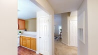 This 2-bedroom, 1-bathroom single-story home in Columbia, SC offers a thoughtfully designed layout with standout architectural details. The living area immediately impresses with soaring vaulted ceilings that amplify the sense of space and allow natural light to pour in through large windows dressed with sheer curtains. Neutral-toned walls and plush carpeting create a warm, cohesive atmosphere throughout.

The kitchen is well-equipped, featuring warm honey-toned oak cabinetry that extends to the ceiling for ample storage, white appliances, generous counter space, and wood-look flooring — a practical and inviting space for everyday cooking.

Connected hallways provide smooth flow between the living areas and bedrooms. The primary bedroom is generously proportioned with vaulted ceilings, a large window for natural light, and direct access to a dedicated walk-in closet complete with wire shelving. The second bedroom is bright and functional, with a window and closet access. The full bathroom offers wood-look flooring, a vanity with cabinet storage, and a window for natural ventilation.

Two hallways connect the home's key areas efficiently, enhancing the overall flow. This well-maintained home delivers comfortable, functional living in a clean and cohesive design.