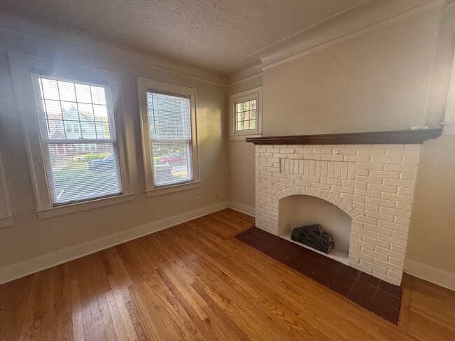Living room windows and fireplace - 166 Jewell St