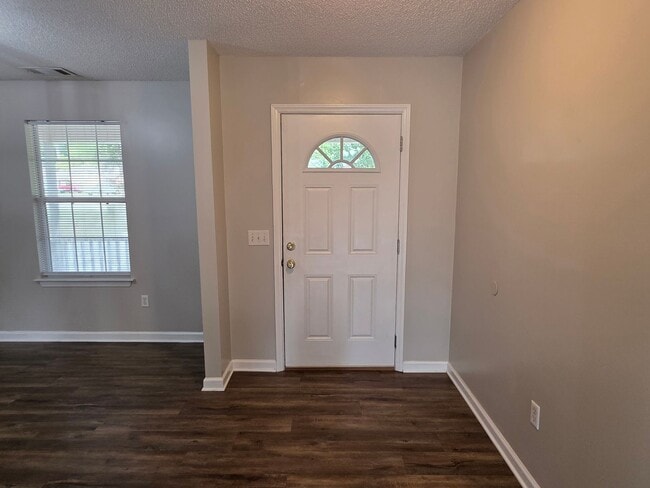Building Photo - Woodbury Subdivision. 3 bedrooms. 2 baths. Two car garage. Family with vaulted ceiling. Separate ...
