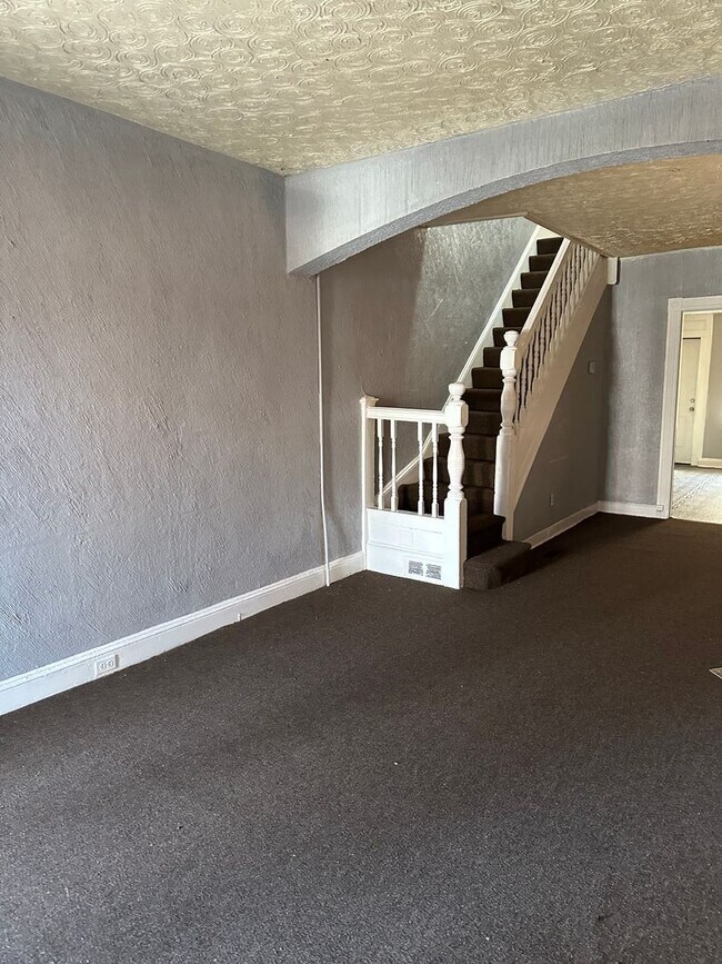 Building Photo - Spacious Rooms! Partially Finished Basemen...