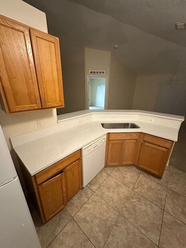 Building Photo - New Paint, Floors and Solid Surface Counte...