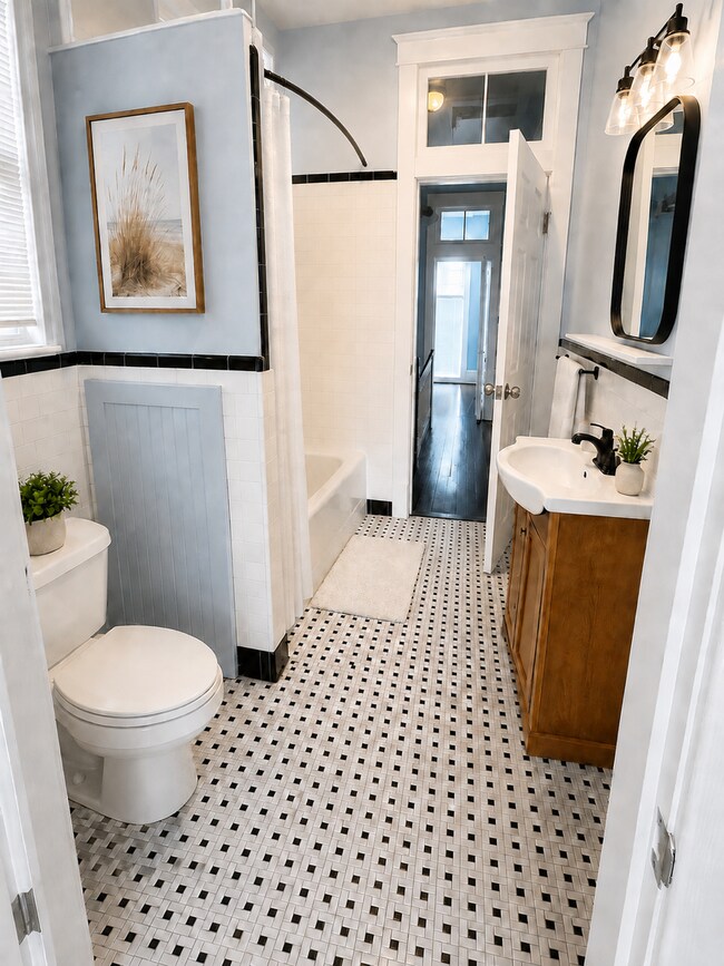 Updated full bathroom - 319 W 33rd St