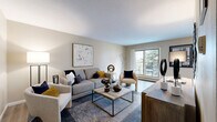 Located at 6325 Camden Ave N in Brooklyn Center, Minnesota, this 2-bedroom, 1-bathroom residence offers a thoughtfully organized single-floor layout designed for comfortable everyday living. The living room serves as the heart of the home, featuring wood-style flooring, a textured ceiling, and a large sliding window that frames views of mature trees and an outdoor balcony, filling the space with natural light. Adjacent to the living area, the dining room accommodates a round dining table and benefits from its own window overlooking the surrounding neighborhood. The galley-style kitchen is efficiently designed with rich wood cabinetry, dark granite countertops, stainless steel appliances, and a double sink — maximizing both storage and functionality in a compact footprint. The primary bedroom offers a comfortable, carpeted retreat with a window providing natural light and a dedicated closet. The second bedroom also features carpet, a built-in closet, and access to the hallway. Three closets throughout the unit provide ample storage. The bathroom is clean and classic, featuring a wood vanity with a white countertop, tile flooring, and a tiled tub surround. A connecting hallway ties all rooms together in a cohesive, easy-to-navigate layout.
