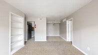 Located at 6233 Gulfton St in Houston, TX, this single-story, 3-bedroom, 2-bathroom home offers a practical and functional layout across a compact, efficiently designed floor plan. The bedrooms are carpeted and each equipped with a ceiling fan and a dedicated closet, providing comfortable and organized living spaces. The generously sized primary bedroom features a window with blinds that allows natural light to filter in, creating a bright and airy atmosphere. The two additional bedrooms also include ceiling fans and closets with built-in shelving rods for convenient storage. Both bathrooms feature tile flooring, tub-shower combinations with white tile surrounds, and one includes a granite-topped vanity, adding a touch of elegance. The kitchen is outfitted with gray cabinetry, granite countertops, and a striking stone mosaic tile backsplash that adds visual interest to the space. The adjacent dining area features light tile flooring and a pendant light fixture overhead. A clean, neutral color palette of soft grays and whites throughout the home creates a cohesive and move-in ready aesthetic, while ceiling fans in multiple rooms ensure year-round comfort.
