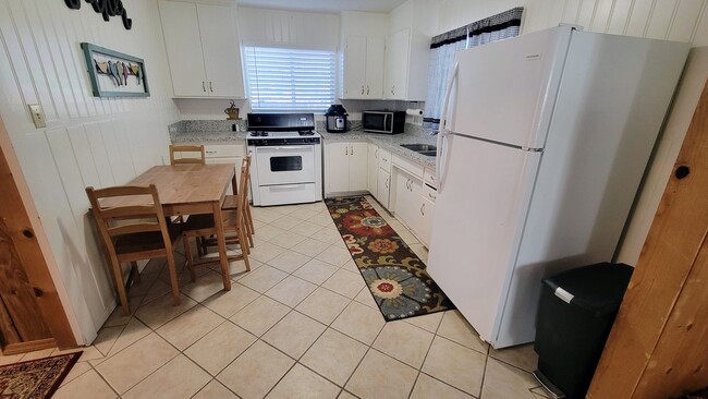 Building Photo - Cozy Studio on a Spacious Corner Lot – All...