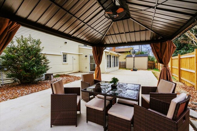 The sunroom opens up to a back patio with: gazebo, basketball hoop, swings, barbeque grill, and pool - 34 Shenandoah Dr