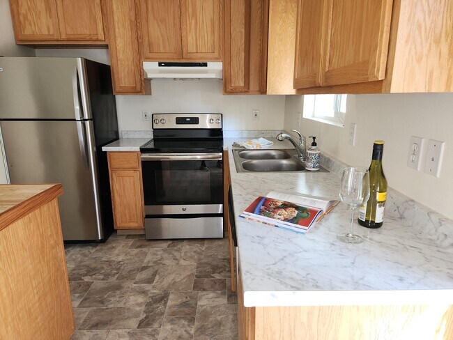 Kitchen, new counters, floor, stainless appliances - 6187 Pine Rd NE