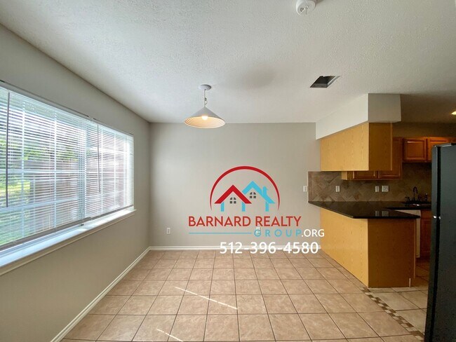 Building Photo - Available July 11: 3 bedroom, 2.5 Bath Duplex with Garage and Fenced Yard