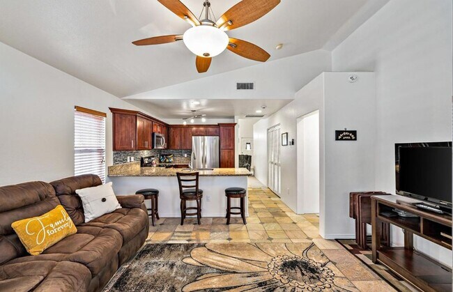 Building Photo - Single Story with large covered patio. Two car garage with uncovered gated parking stall. New vin...