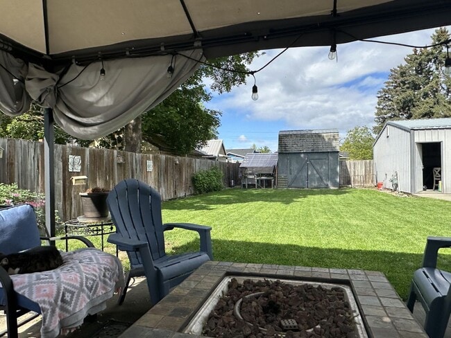Building Photo - 4 bedrooms, 1.5 baths Millwood-20x30 shop ...