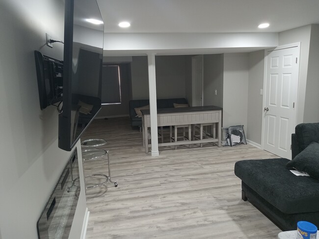 Family room with spacious extended area. - 609 S Avon Ct
