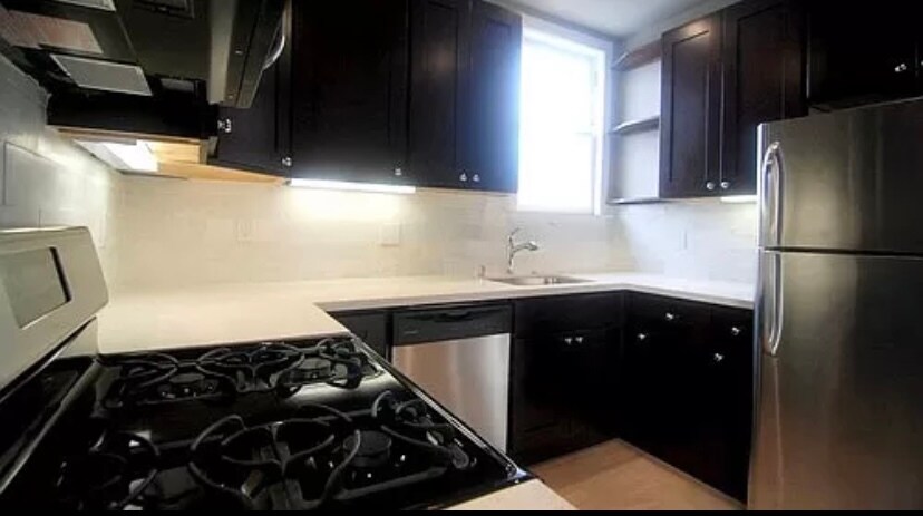 Updated kitchen with granite countertops and stainless steel appliances - 3468 Mission St