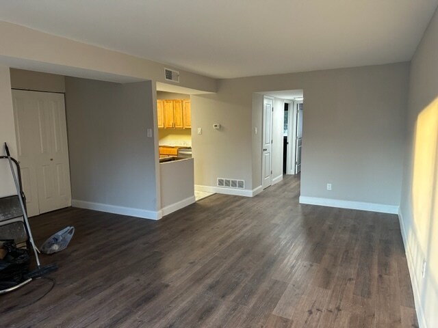 Living Area looking into kitchen and hallway bathroom and bedrooms - 742 Putnam Blvd