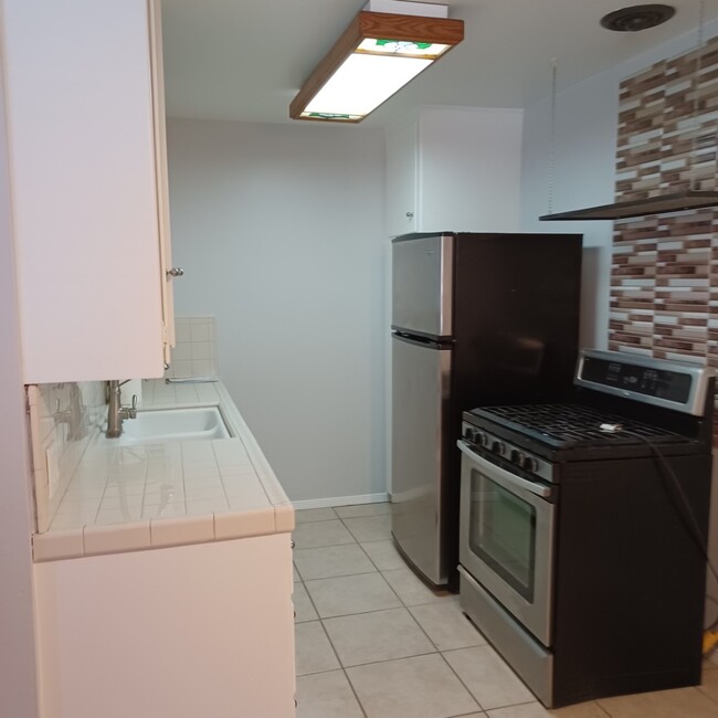 Kitchen includes a New Fridge and gas stove - 930 E 1st St