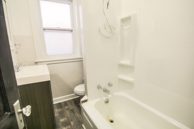 Building Photo - This 2 bedroom 1 bath home has been completely refinished with brilliant hardwood floors throughout!