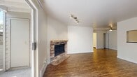 This 550 square foot apartment in Lake Oswego, Oregon, offers a thoughtful blend of comfort and functionality. The single-floor layout comprises one bedroom, one bathroom, and an open-concept kitchen and living area. The primary bedroom, measuring 150 square feet, provides ample space and features a built-in closet with sliding doors for efficient storage.

The living area is characterized by its bright, airy ambiance, enhanced by large windows that flood the space with natural light. Rich wooden flooring throughout adds warmth and continuity to the apartment. A standout feature is the corner fireplace with a brick surround, creating a cozy focal point in the living room. The space also includes a sliding glass door, offering easy access to the outdoors.

The kitchen, while compact, is well-equipped with modern stainless steel appliances, light wood cabinetry, and dark countertops, creating a contemporary aesthetic. Track lighting in both the kitchen and living area provides adjustable illumination options.

The bathroom continues the modern theme with a wooden vanity topped with a sleek black countertop. Overall, this apartment maximizes its 550 square feet through smart design choices, creating a comfortable and stylish living space in the heart of Lake Oswego.
