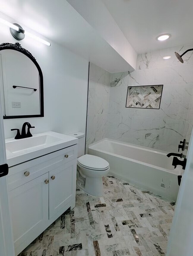 Building Photo - Fully Renovated, Sunny Basement Apartment