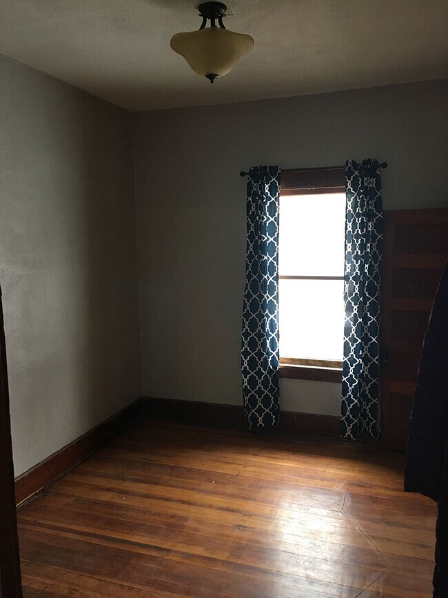 Bedroom 2 . Refinished original floors. - 807 Main St