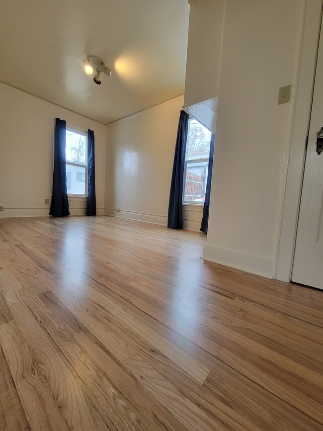 Bright bedroom with blackout curtains for privacy - 909 8th St