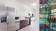 Located at 400 N Main St in Glen Ellyn, Illinois, this contemporary single-floor residence offers a thoughtfully designed open-concept layout that seamlessly connects the kitchen, living, and sleeping areas. Light wood-style flooring flows throughout, contributing to a bright and cohesive aesthetic.

The modern kitchen is a standout feature, outfitted with a two-tone cabinet design pairing crisp white upper cabinets with rich dark lower cabinetry, complemented by white quartz countertops and a classic subway tile backsplash. Stainless steel appliances — including a gas range, refrigerator, dishwasher, and microwave — complete the well-appointed space.

The open living area extends naturally toward a sliding glass door that opens to a private balcony, allowing abundant natural light and offering pleasant outdoor views of the surrounding Glen Ellyn neighborhood. The spacious bedroom area accommodates both sleeping and lounge furnishings comfortably, with large windows that further enhance the airy feel.

The bathroom is finished with elegant floor-to-ceiling textured tile in the tub/shower surround, brushed nickel fixtures, a white vanity with ample storage, and an illuminated mirror. A generous closet with built-in shelving provides practical storage. The overall design balances clean, modern finishes with a warm and inviting ambiance.