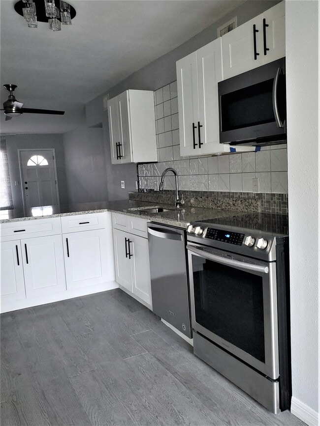 Kitchen upgrades include granite, new cabinetry, brand new top of the line gourmet appliances - 2072 Australia Way W