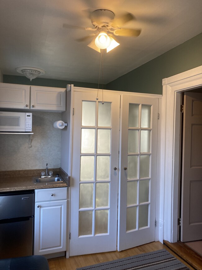 Pane door entrance to bathroom from bedroom and kitchenette - 46 Noyes St