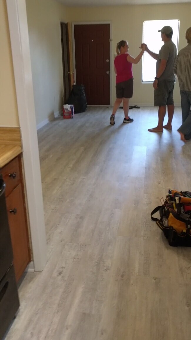 view from kitchen to living room. Coat closet just to left of front door. - 3244 Redwood Ln