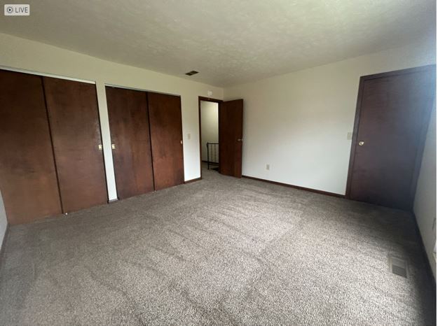 older townhome bedroom - Evergreen Apartments